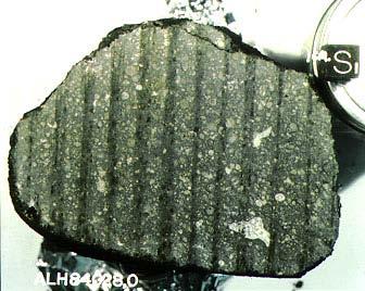 Carbonaceous chondrite meteorites are black because they contain carbon, like soot or pencil lead They also contain water, complex