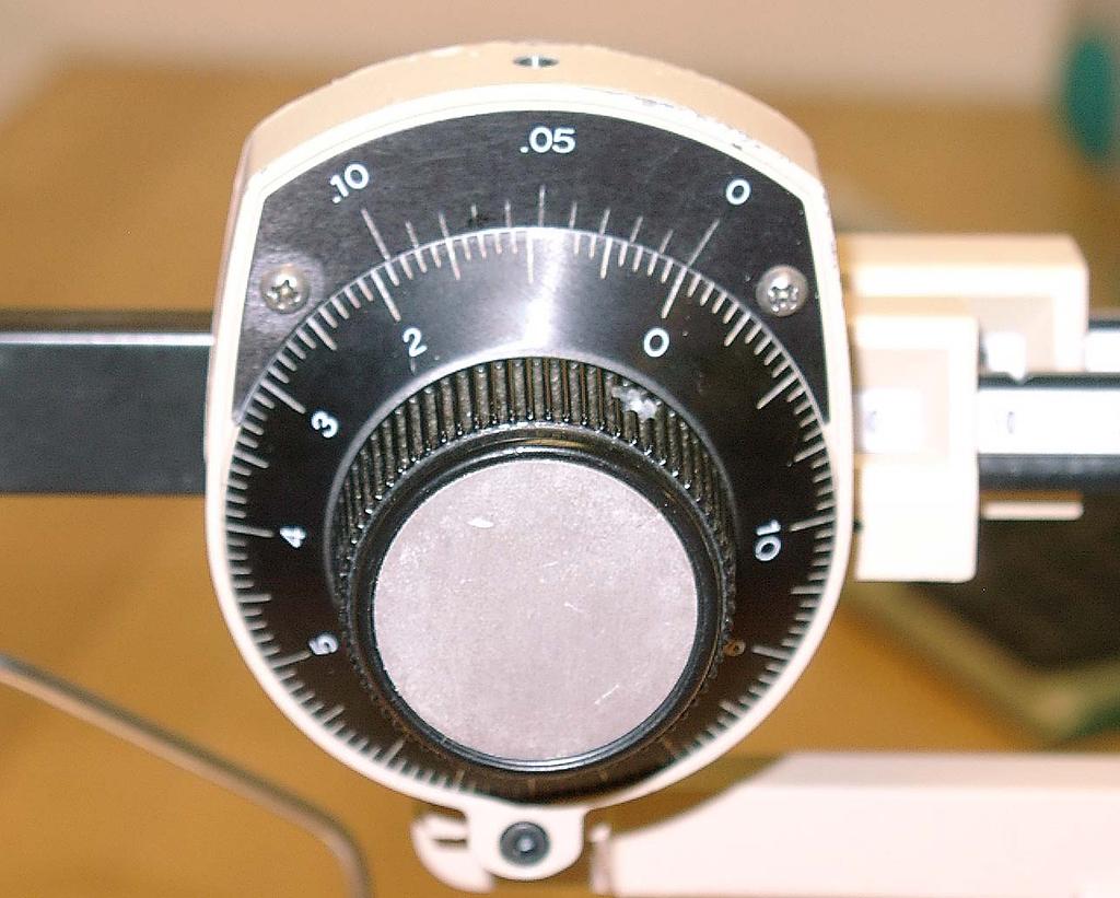 To calibrate, slide all poises (sliding masses) to zero; rotate the dial to zero.