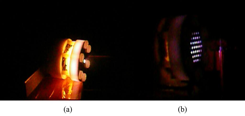 Figure 13. Thruster view during operation, (a) in the single-hole grid configuration, and (b) in the extractiongrid configuration. A 1/8-in.