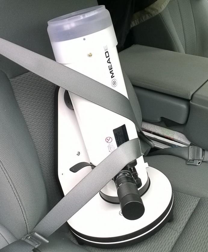 Buckle the telescope into the seat as you would a person. 3. Unpacking and Setting Up the Telescope 1. Carefully unbuckle the telescope from the seat belt. 2. Gently lift out of the seat.