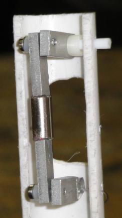 64 Figure 3-11: Photo of Linear Reverse Pendulum Harvester. The magnet was attached with spring pins. The top back hinge is a Teflon rod and the other two hinges are shoulder bolts.