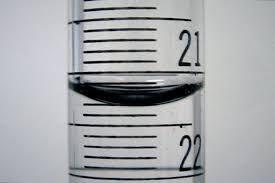 The meniscus in a graduated cylinder is formed because of