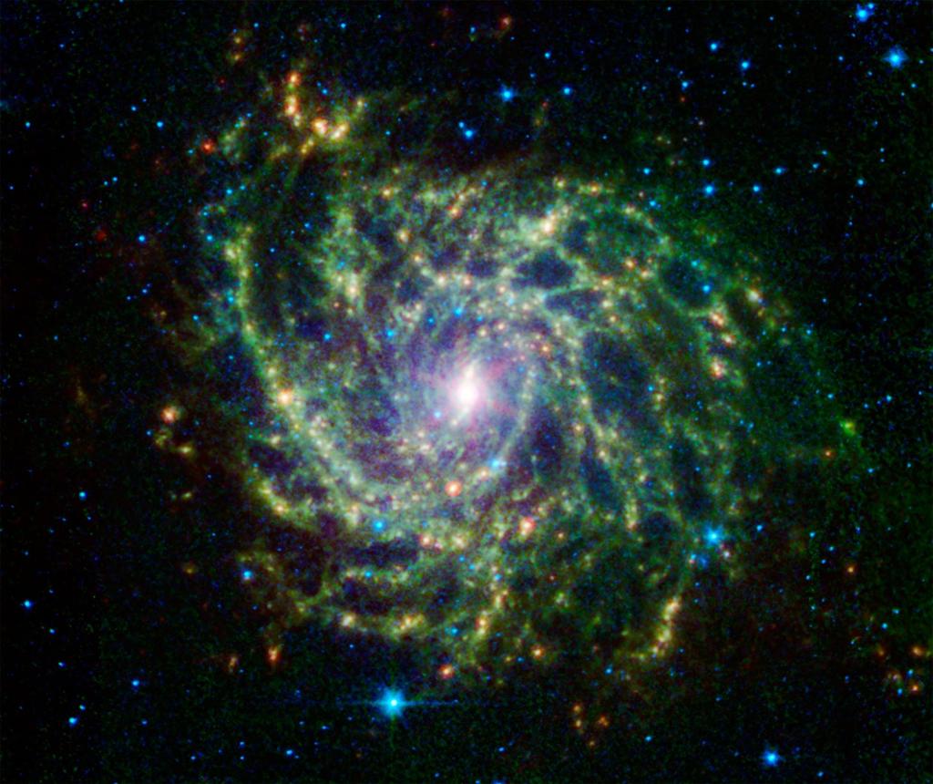IC 342 Infrared image Spitzer's infrared array camera (IRAC) are shown in blue (3.6 and 4.