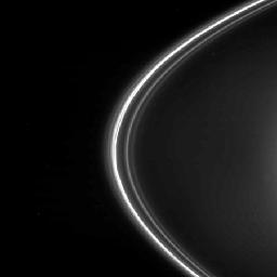 Saturn s moon Prometheus (63 miles across), followed by Pandora, is seen