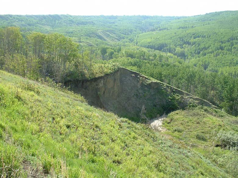 Photo E197 3+000 Large landslide below highway.