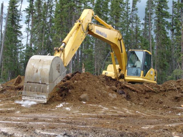 Photo 3: Backhoe being used to strip overburden.