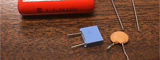 Usually, capacitors are built by rolling up two conuctor sheets with a ielectric between them, in orer to save space: S σ E = ε V V 2 2 a) Builing a capacitor b)
