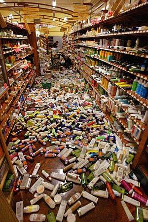 Earthquake Damage Eureka Natural Foods employees clean up the