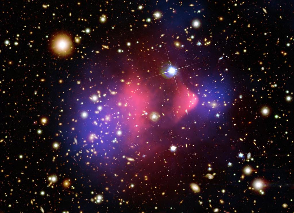 Introduction to Dark Matter Evidence for Dark Matter Figure : The Bullet Cluster : Hot gas detected in X-rays (pink), visible matter (white and orange), and gravitational lensing