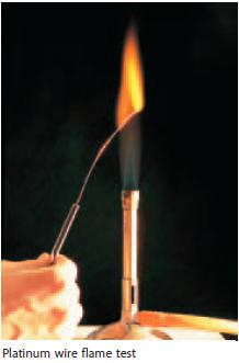 EXAMPLE A A scientist dips a platinum wire into a solution containing salt (sodium chloride), passes the wire over a flame, and observes that it produces an orange-yellow flame.