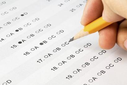 Q7. The picture shows a student using a pencil to complete a multiple choice answer sheet.
