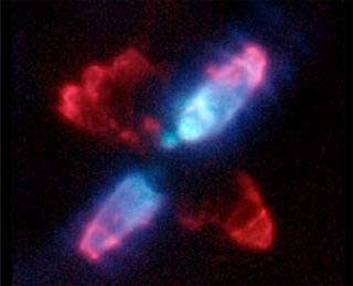 The bright blue lobes are lit up by scattered light, as can be