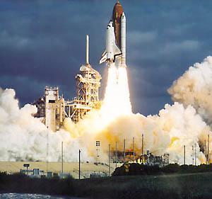 The rocket expels propellant at a high velocity backwards.
