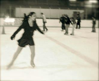 A skater is standing on a frictionless ice rink.