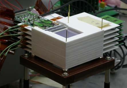 The strips on the p-side are connected directly to the input of the ASIC, while the strips of the n-side are connected via coupling capacitors.