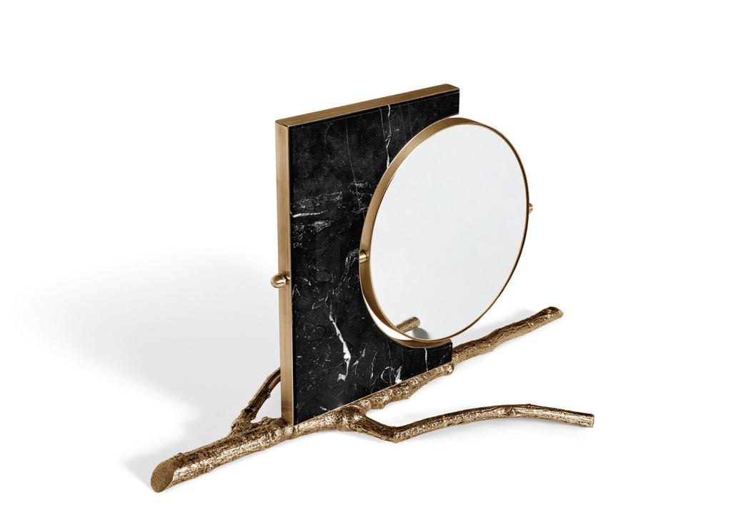Flow Table Mirror Along the shores of a river bank, tree branches capture objects flowing along the stream.