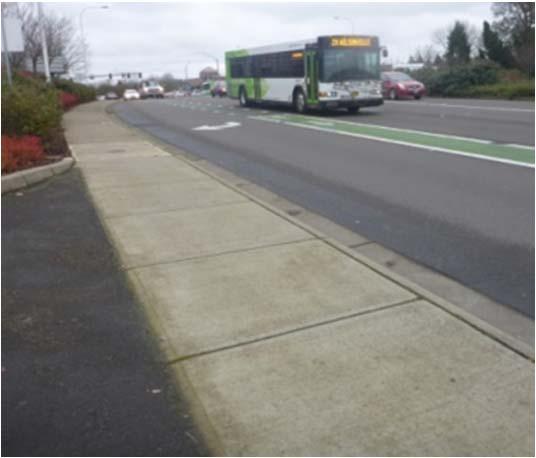 Looking south at the multi-use path fenced entrance from Wilsonville Road (left), and the multi-use path connection with the sidewalk along Wilsonville Road (right) The photos above show different