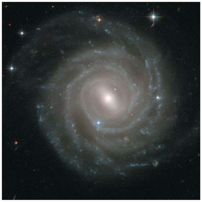Gravitational attraction Our solar system is part of a spiral galaxy like this one, which contains roughly 10 11 stars as well as gas, dust, and