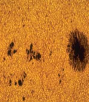 SURFACE FEATURES OF THE SUN Sunspots - a region on the Sun s surface that is cooler than the surrounding areas. By contrast it looks darker.