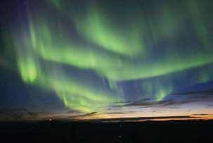 THE AURORA BOREALIS The solar wind is responsible for creating the breathtaking displays of green, yellow, and red light in the skies near Earth s northern and southern regions.
