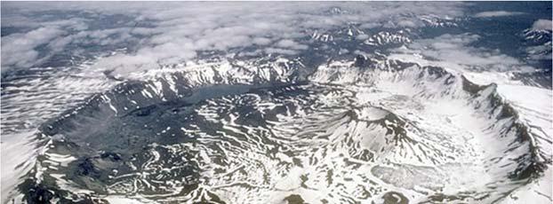 seen at top of the photograph. Aerial view, looking east, of Aniakchak caldera.