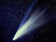 Comets Bright object with long, wispy tail pointing away from the