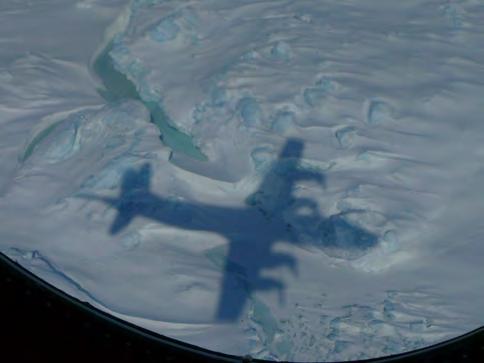 REMOTE SENSING IS A TOOL THAT CAN LOOK THROUGH THE ICE Image 3) Shadow image of aircraft flying over Greenland as it sends out and collects energy signals as it gathers data on the ice sheet and