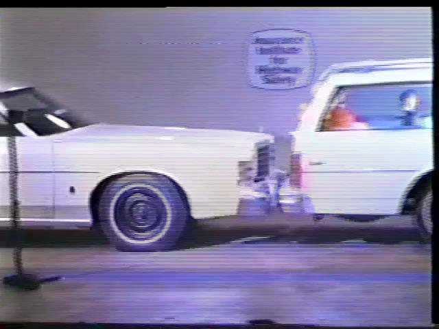 Video Clip : Focus on the crash test dummies in the back of the station wagon.