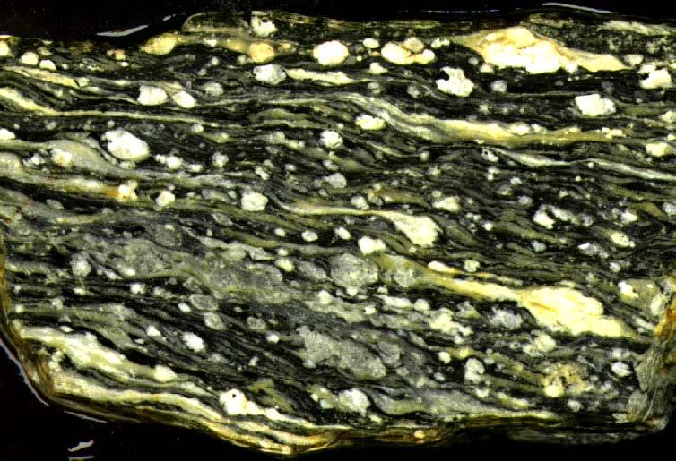 Metamorphic Rocks We recognize 3 divisions of metamorphic rocks: 1) Foliated; display a prominent