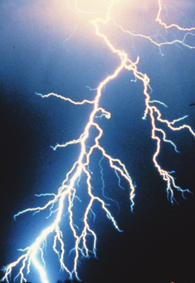 STAPLE HERE Cover Photo: A cloud-to-ground lightning strike during a nighttime thunderstorn. Taken by C. Clark. Released into the public domain by NOAA.