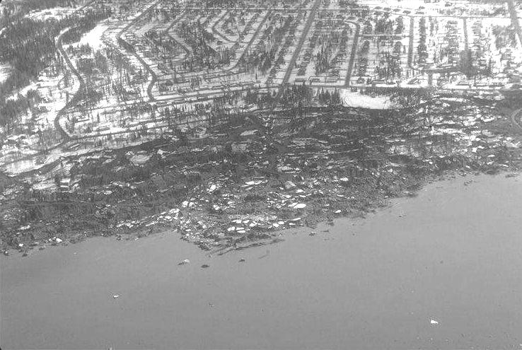 The figures that follow show examples of the types of damage that can result from liquefiable soils. Figure 1-1 shows an example of a liquefaction-induced landslide during the 1964 Alaska earthquake.