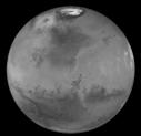caps: very bright, consist of H 2 O and/or CO 2 ice These surface markings observed to change over time Clouds can also be seen on Mars White clouds composed of