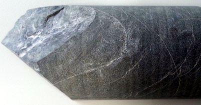 05 m; photo is 1.4 m in width); e) example of brittle deformation in gabbro, manifested by multiple vein generations, in contrast to the basalt at the extreme top of the photo (GOS28, 188.