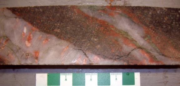 the Gossan Hill prospect: a) massive quartz veins (V4) in a shear zone; note
