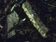 a. b. Fig. 13: Gravel 2 crystalline Plagioclase with grain size 0.1-0.2 mm. Polarized light microscope: a. Magnification scale 40x b.