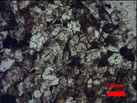 Fig.15: Gravel 2 a. Sandy material with chloride cement content observed in polarized light microscope. Magnifications scale 40x. b. Black spots represent opac minerals (magnetite, pyrite, etj.