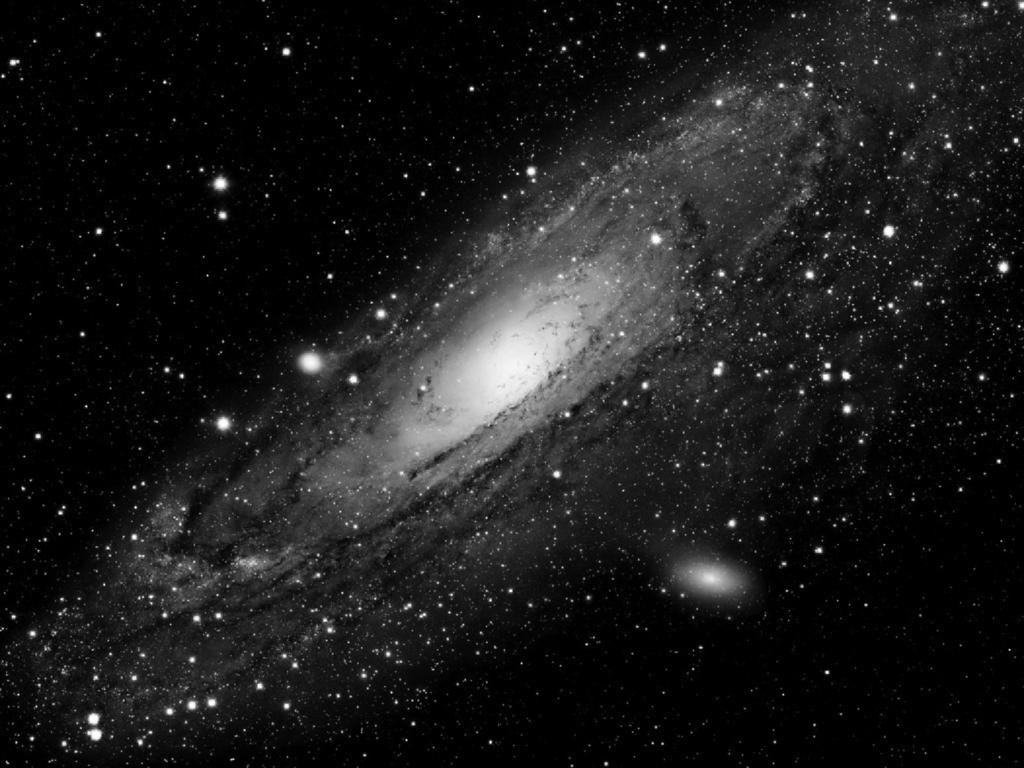 6 6 Fig. 6.1 shows an image of the Andromeda galaxy taken by the Hubble Space Telescope. The image contains 4096 3072 pixels as shown. 3072 pixels 4096 pixels Fig. 6.1 The resolution of the image is 30 light years per pixel.