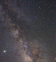 Milky Way That clumpy band of light is evidence that we live in a disk-shaped galaxy.