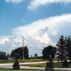 When seen in profile from a distance, a cumulonimbus cloud has a