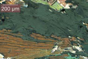 Photomicrograph of pyrrhotite interleaved along cleavage planes in graphite Conclusions and recommendations Graphite explorers are urged to get back to basics and use thin section petrography as a