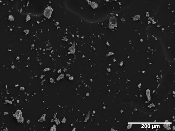 76 previously described. The microspheres fluoresced when illuminated by an ultraviolet lamp. The SEM images in Figure 5-6 demonstrate some aggregation of the microspheres.