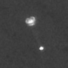 NASA's Mars Phoenix Lander can be seen parachuting down to Mars, in this image captured by the High Resolution Imaging Science Experiment (HiRISE) camera