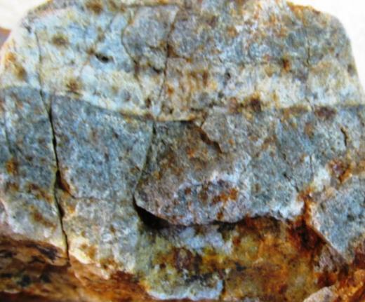 6 x 2 mi area At least two phases of porphyritic granodiorite intrusions of late Eocene age Central zone of quartz
