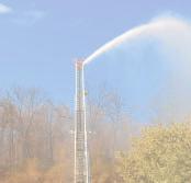 6.3 Completing the Square GOAL Write the equation of a parabola in verte form by completing the square. LEARN ABOUT the Math The automated hose on an aerial ladder sprays water on a forest fire.