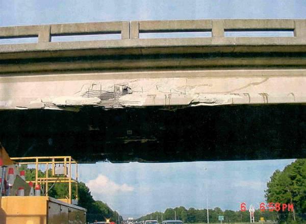 3 A practical example of these types of repairs is shown in Figure 1-2. In this case, an AASHTO girder was hit by an over height vehicle and was subsequently repaired with FRP composites.