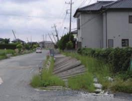 2. Although the main roads were restored to some extent by June 2011, leaning utility poles were left as is (photo A in Fig.2).