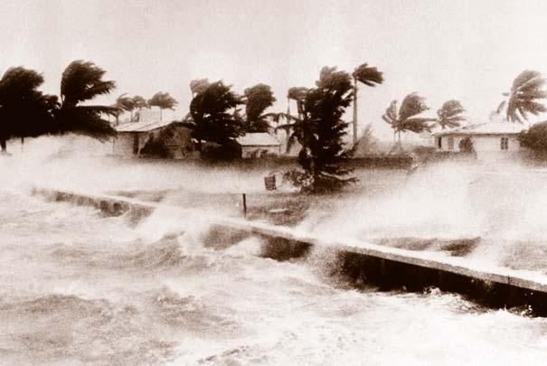 High waves from the September 1945 hurricane flood in Miami The next morning, the wind speed picks up, and the sky clouds over.