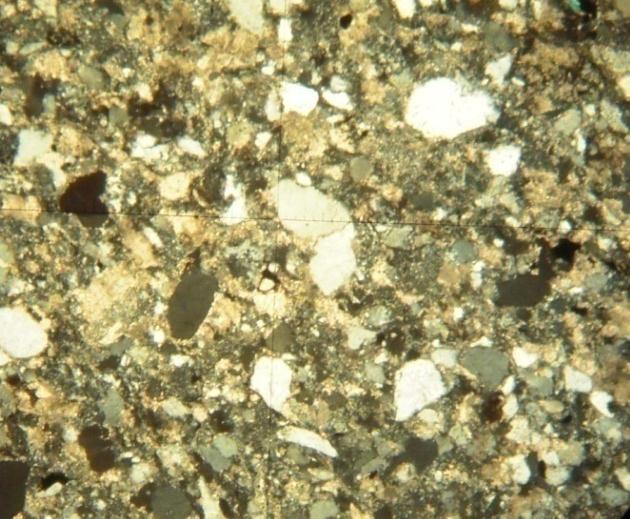 siltstone. L Q 0.1mm Figure 3.1: (Left) Well bedded sandstone of upper mine sequence.