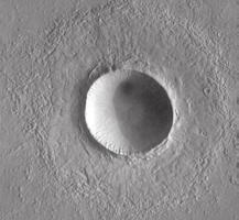 FIGURE 9 Crater shapes on Mars tell us about Martian geology. (Photos from Mars Global Surveyor (a) and Viking spacecraft (b and c).