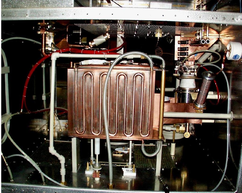 The resonator in Figure 8 is water cooled to ensure long and reliable oeration. Inside the coer resonator are water cooled vacuum caacitors.